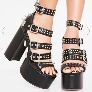 Black Dolls kill spiked platform hill